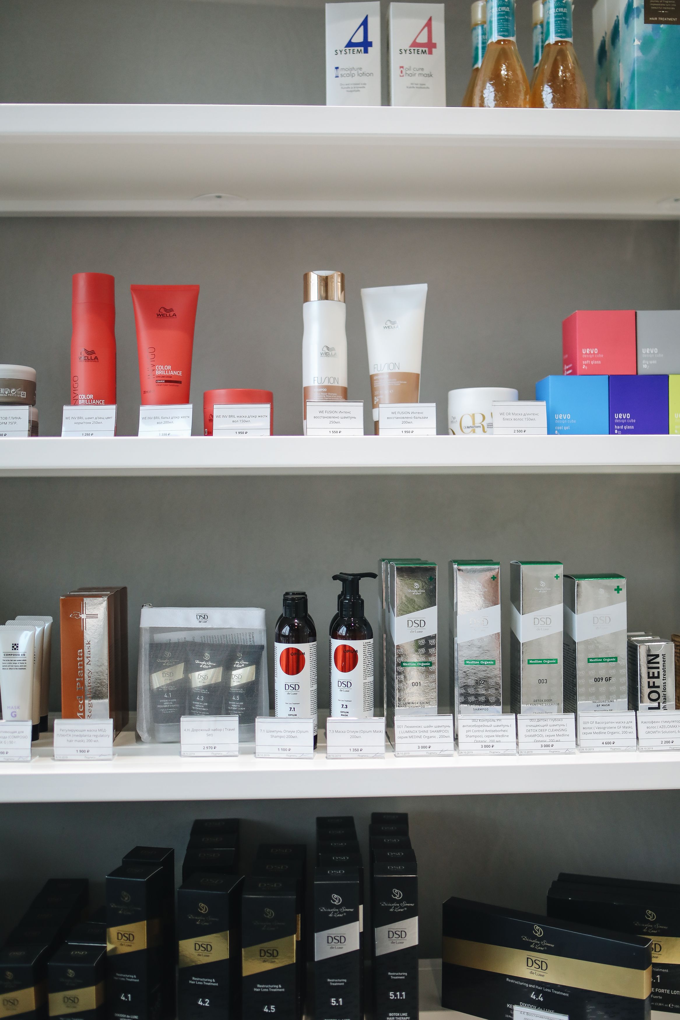 Retail shelves stocked with beauty and hair care products