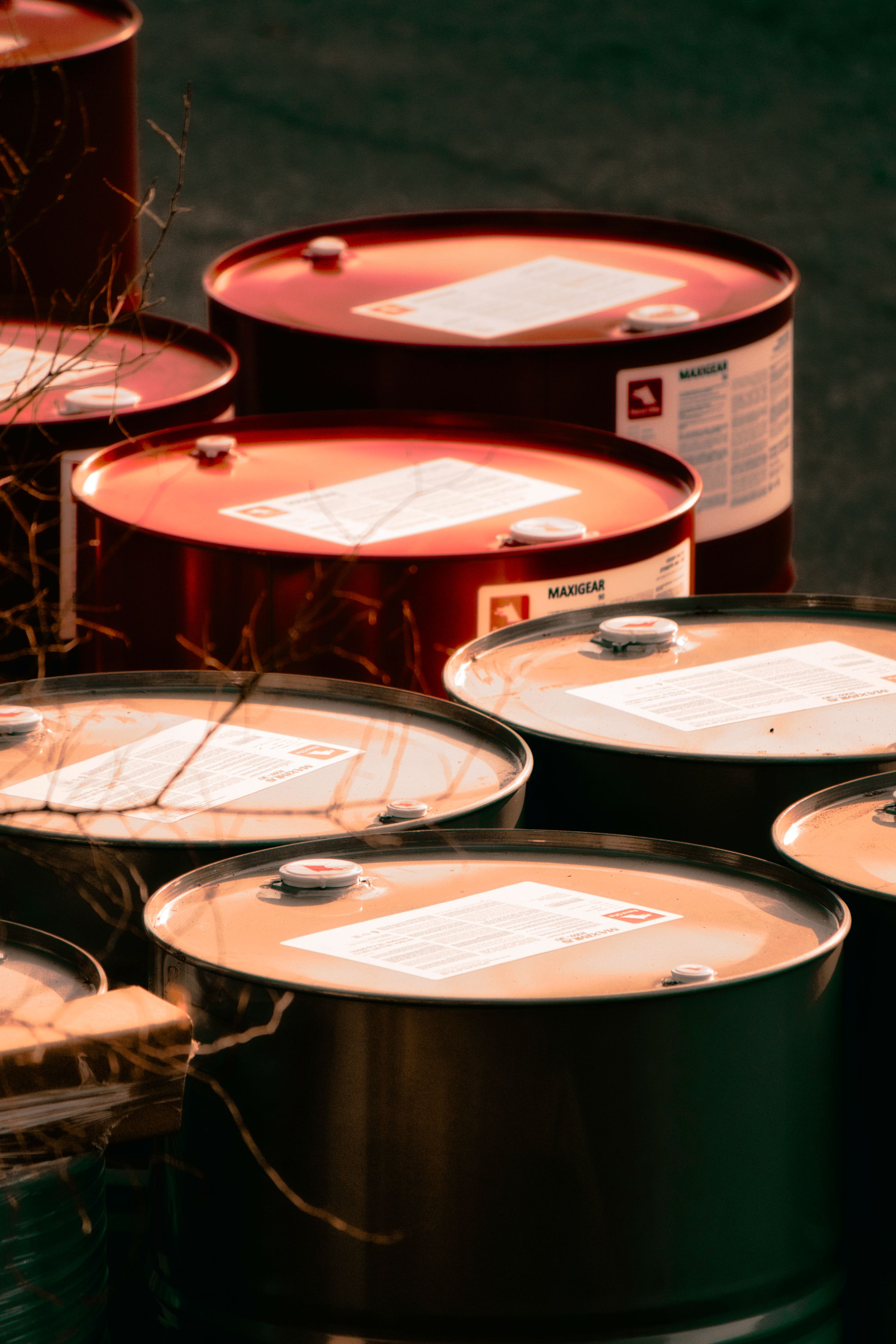 Drums of petroleum lubricant product staged outdoors