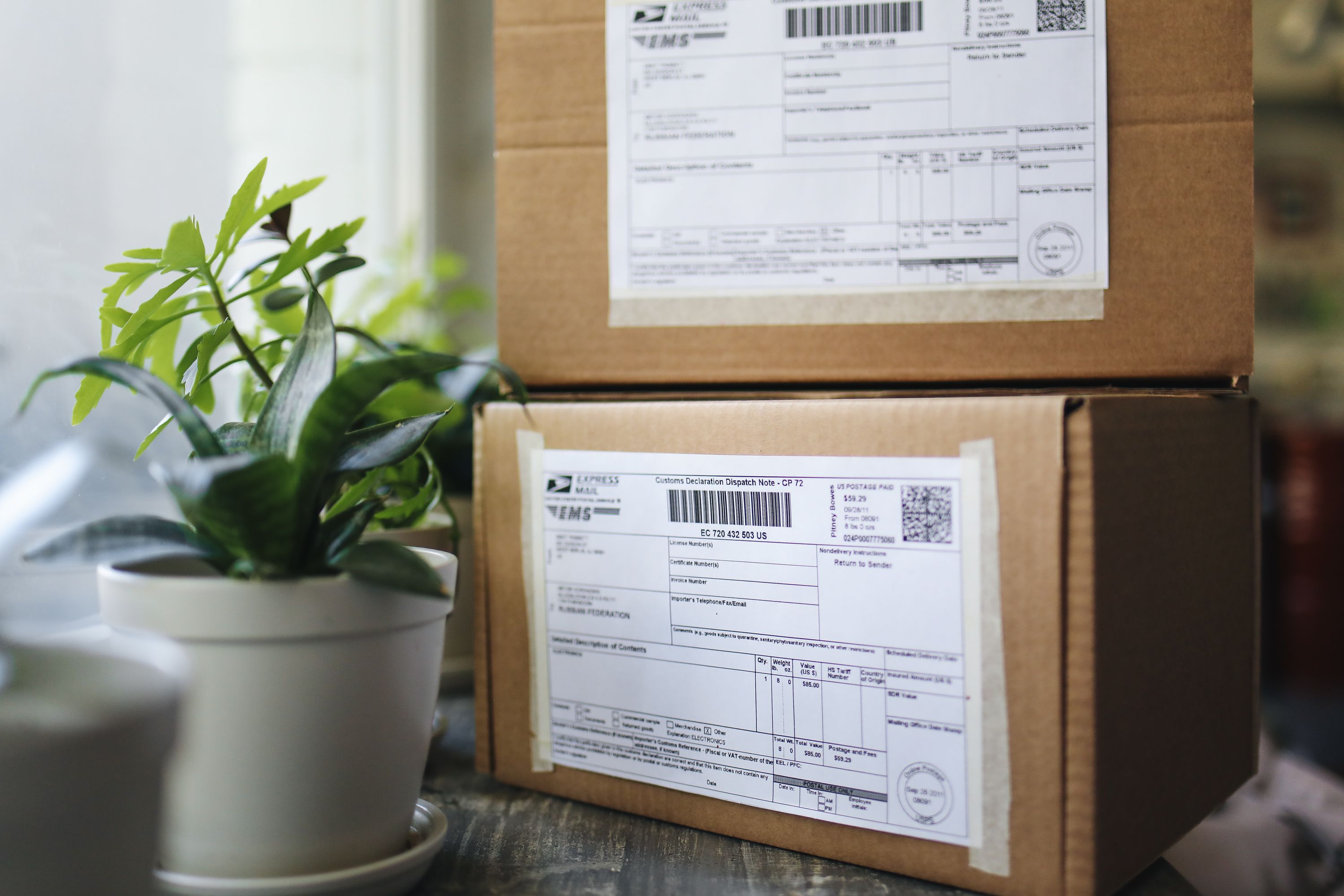 Stacked shipping boxes with packaging labels