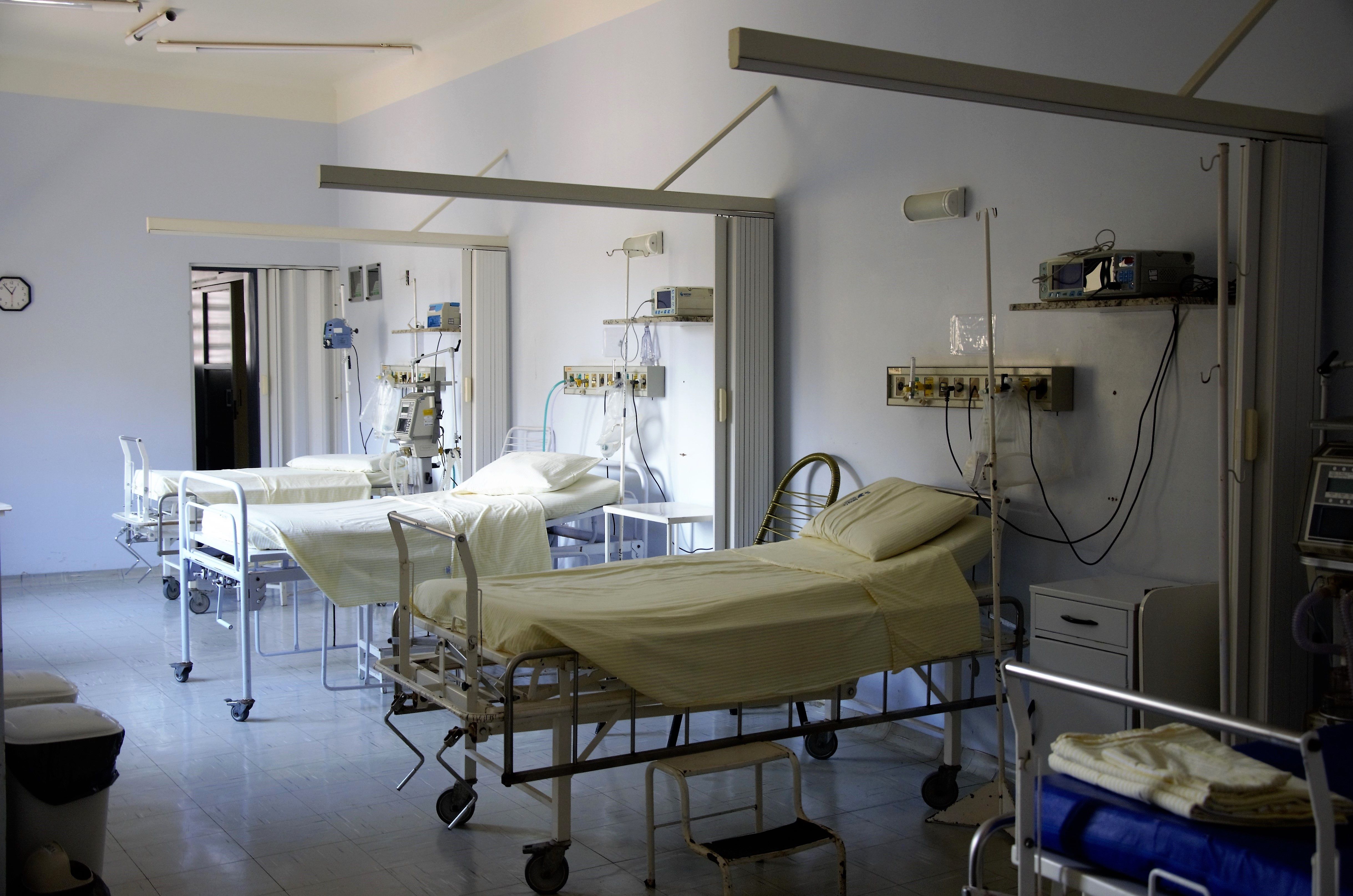 Empty hospital ward with patient beds