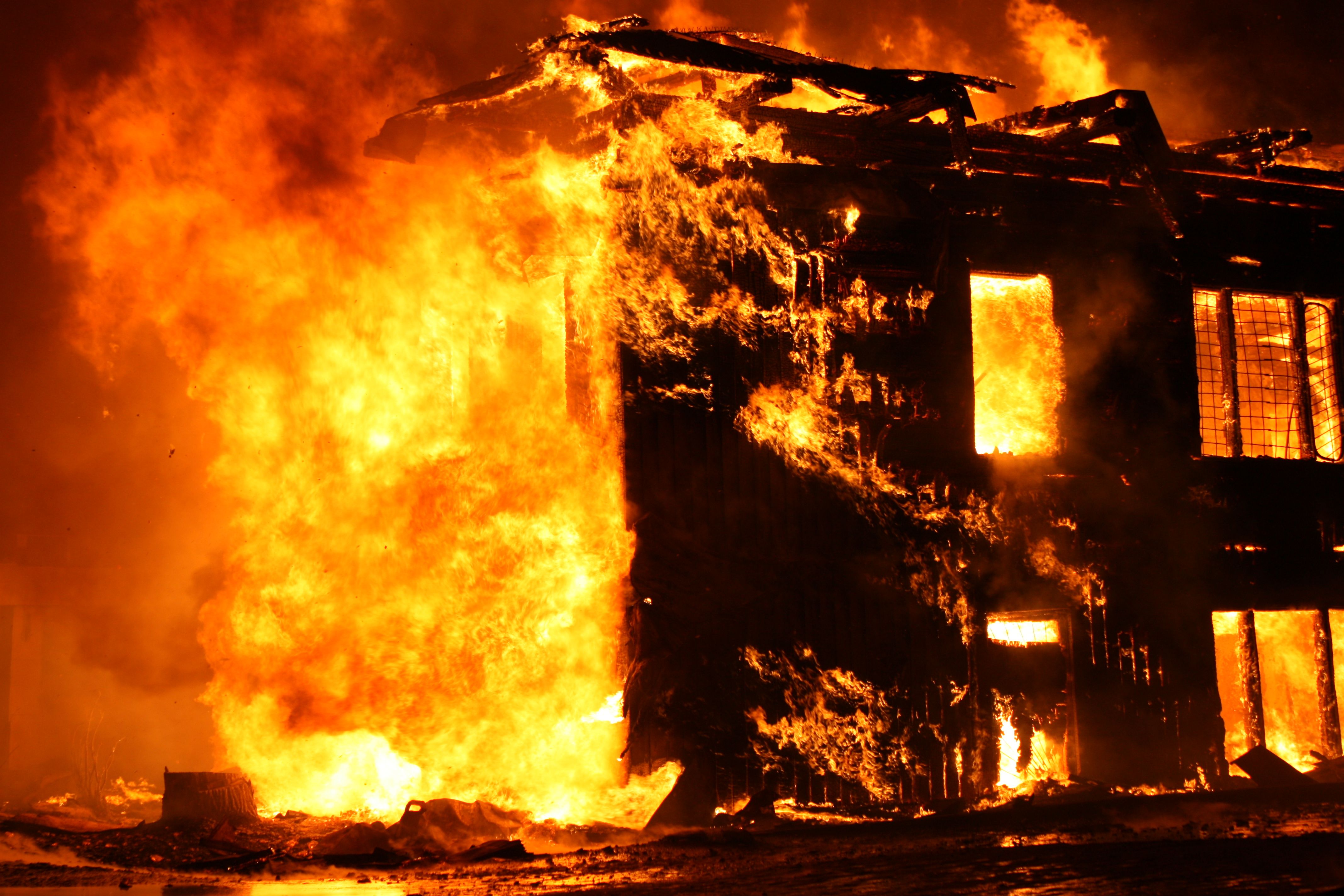 House engulfed in fire at night
